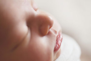 Close-Up of tiny baby's face taken by newborn photographer Glasgow