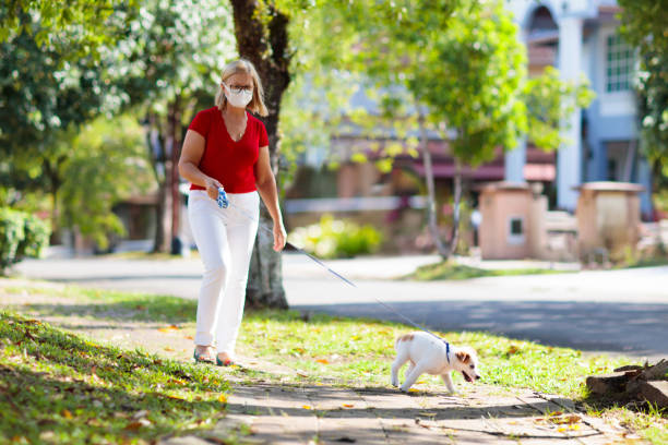 middle aged woman walking her dog